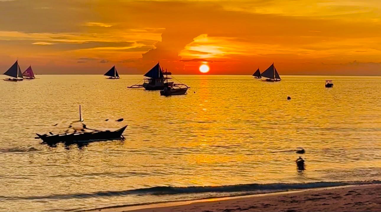 Sunset at Angol Point with paraw sailboats